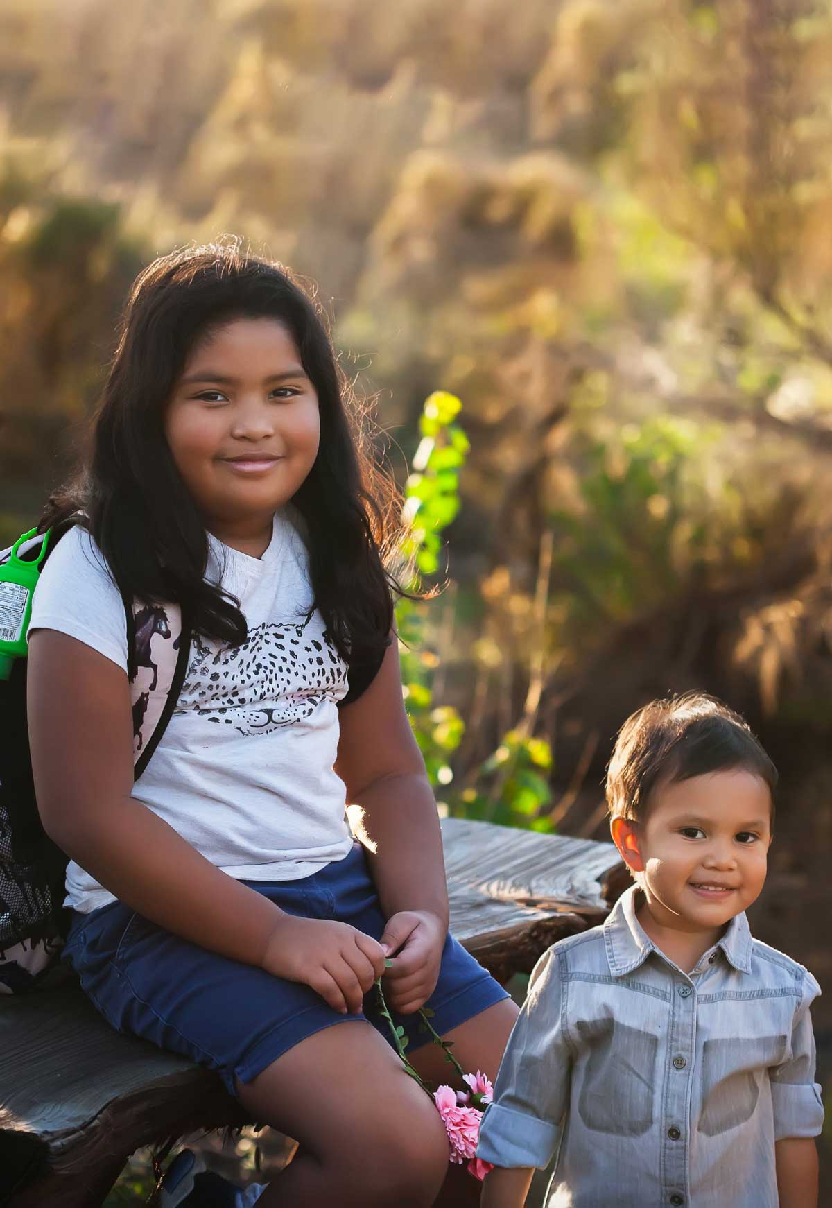 Portrait of a young girl with her brother
